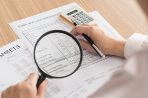 Internal auditor conducting a compliance review in an office setting
