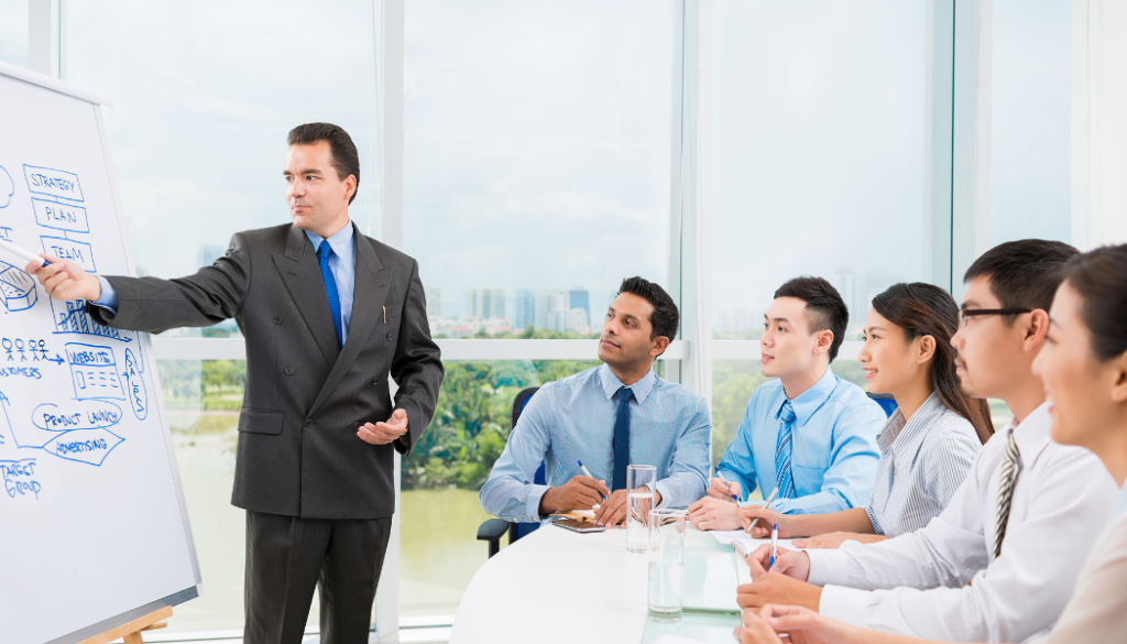 Teacher assisting students in a classroom setting